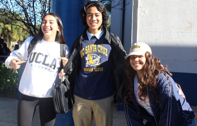 Students Bella Smith, Nick Wang and SaraJoy Salib show off their college wear.