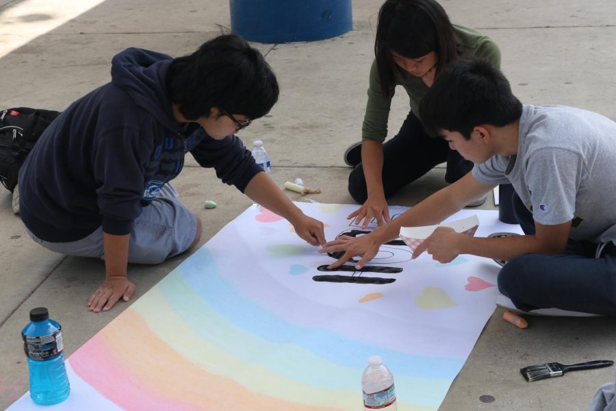 Students make posters for Peace Day.