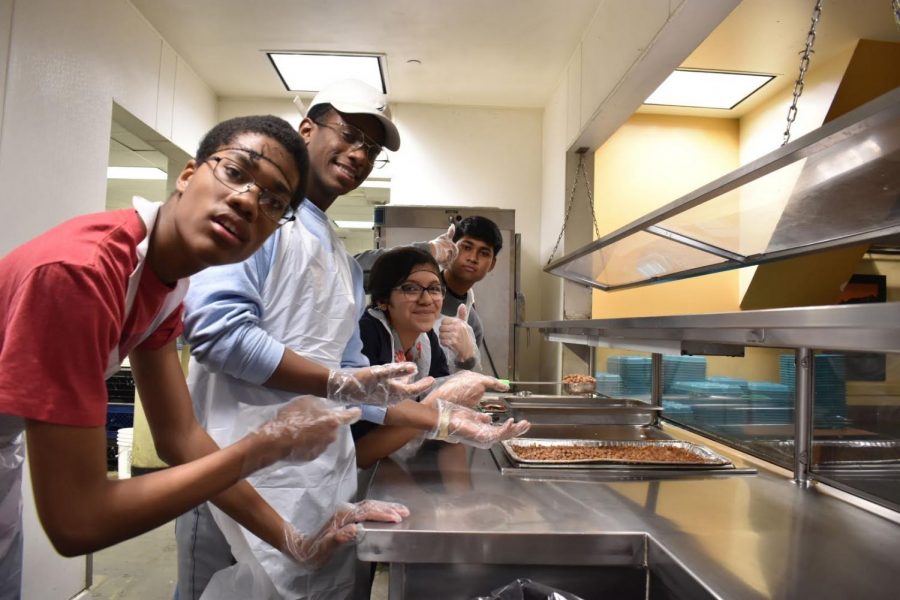 Students help feed the less fortunate at Midnight Mission.