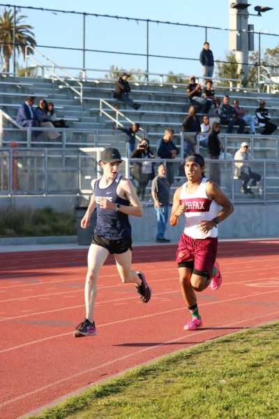 On the way to first place: Junior Paul Tranquilla takes over in the
mile at a home meet Wednesday, April 10.