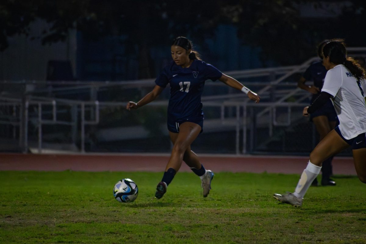 A team player: Freshman Gigi Rodriguez passes the ball at the December 1, 10-1, game against Marshall High School.