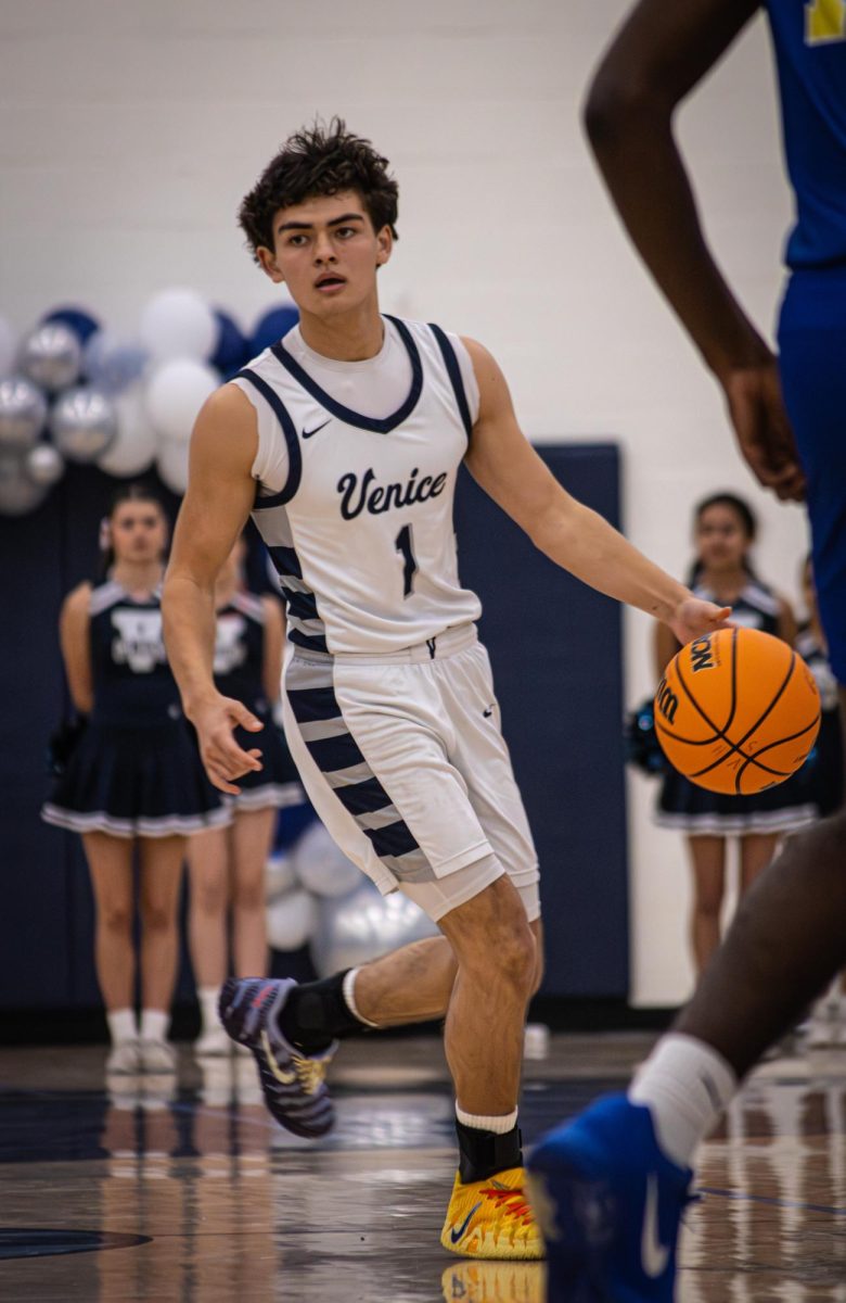 Senior Night: Senior Aiden Charron, a co-captain, takes the ball down the floor against L.A.C.E.S. February 2, 83-56.