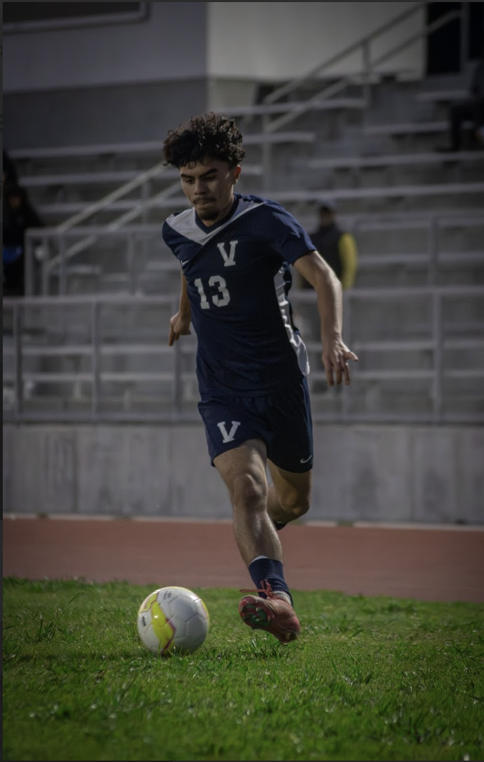Along the side lines: Junior Alejandro Gamero advances play towards opposing goal February 2 against Fairfax, 10-0.