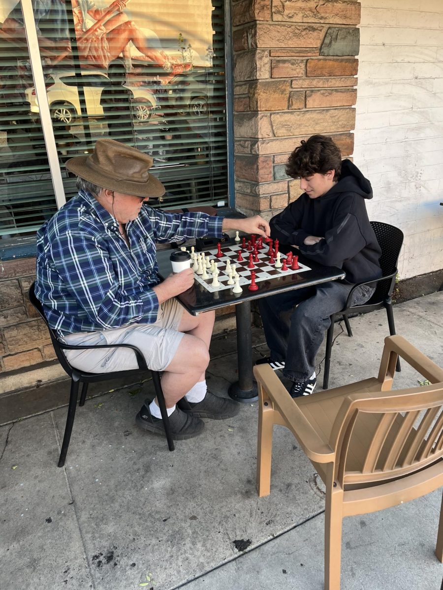 Checkmate: Carl Hyne, also known as the Great Carlini, and junior Lucas Selesnick play a game of chess at a coffee shop in Playa Vista March 7.

Photo courtesy of Katinka van Kerkwijk